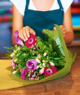 florist wrapping flowers